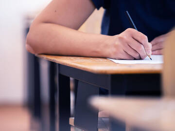 Student writing final exam in classroom 2026 01 09 08 07 51 utc